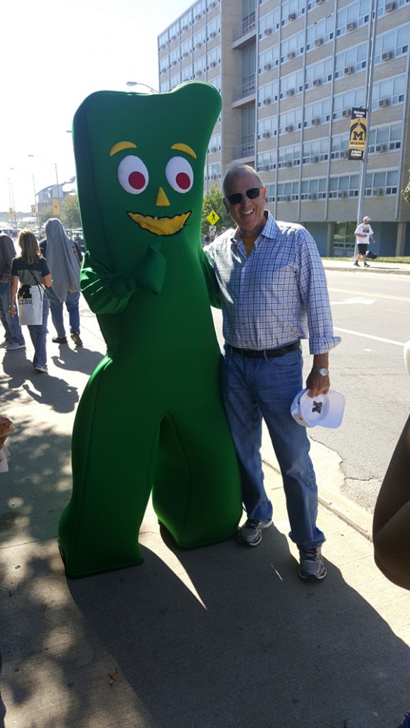 People posing with Gumby.